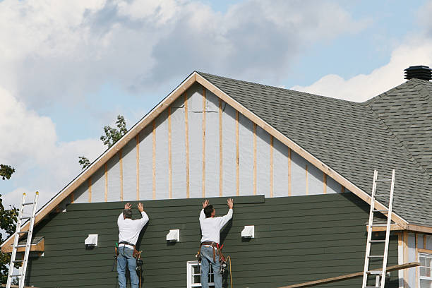 Professional Storm Damage Siding Repair technician working in Fairborn, OH